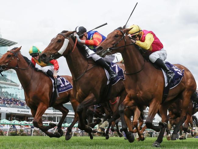 NCA. MELBOURNE. Oaks Day at Flemington Racecourse on November 07, 2024 in Melbourne, Australia.   Race 6. The Melbourne Cup Carnival Country Final.  Electric Impulse ridden by Ben Allen (red and orange hooped sleeves) fights to the line with Oh Too Good ridden by Damian Lane (gold sleeves) and Torranzino ridden by James McDonald in 3rd  .  Picture: Michael Klein