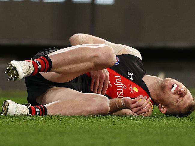 AFL Round15 . Essendon vs Melbourne at MCG, Melbourne. 26/06/2021.  Nick Hind of the Bombers after getting pushed into the behind post during the 3rd qtr.     .  Pic: Michael Klein