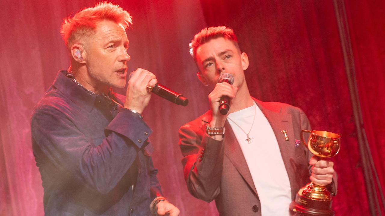 Oaks Day Lunch at Crown Casino. Ronan Keating performs with Melbourne Cup winning Jockey Robbie Dolan. Picture: Jake Nowakowski