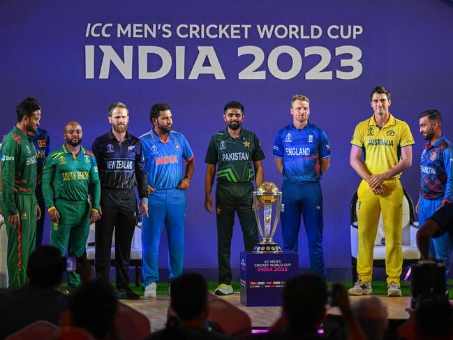 (L to R) Bangladesh's captain Shakib Al Hasan with his counterparts South Africa's Temba Bavuma, New Zealand's Kane Williamson, Indiaâs Rohit Sharma, Pakistanâs Babar Azam, England's Jos Buttler, Australia's Pat Cummins, Afghanistan's Hashmatullah Shahidi and Netherlands' Scott Edwards pose for photograph during the Captainsâ Day event, an interaction session with the media at the Narendra Modi Stadium in Ahmedabad on October 4, 2023, on the eve of the 2023 ICC men's cricket World Cup one-day international (ODI) opening match. (Photo by Punit PARANJPE / AFP) / -- IMAGE RESTRICTED TO EDITORIAL USE - STRICTLY NO COMMERCIAL USE --