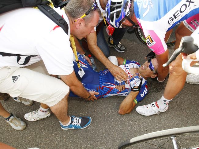 Robbie McEwen receives help after a fall.