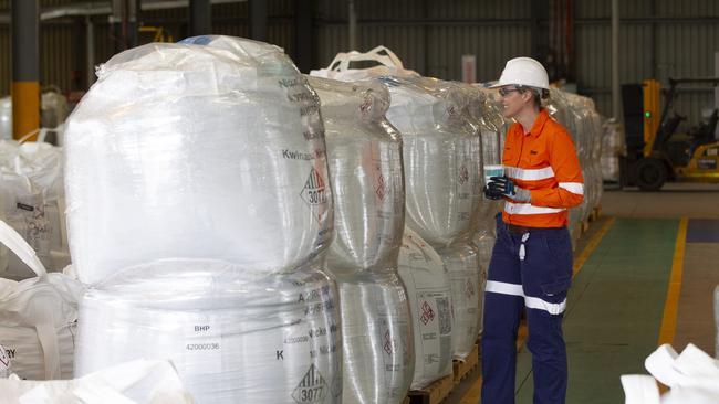 BHP Nickel West Asset president Jess Farrell with bags of nickel product at BHP's refinery at Kwinana.