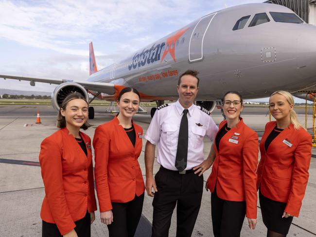 Jetstar crew Ashlea McCallum, Shae Watson, Captain James Thomson, Cabin Manager Zoe Sanders and Breeanna Cooke in front one of two new aircraft based in Adelaide. Picture: Kelly Barnes