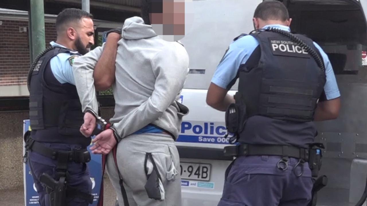 A teen is handcuffed by police and taken to be charged after the brawl. Picture: TNV