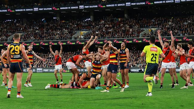 ADELAIDE, AUSTRALIA - APRIL 19: The Crows react as The Bombers celebrate their win during the 2024 AFL Round 06 match between the Adelaide Crows and the Essendon Bombers at Adelaide Oval on April 19, 2024 in Adelaide, Australia. (Photo by James Elsby/AFL Photos via Getty Images)