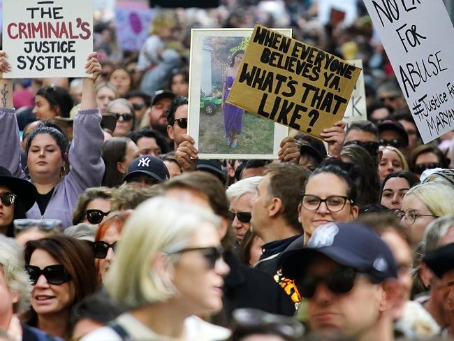 People held up signs like ‘The criminal’s justice system’. Picture: NCA NewsWire / Luis Enrique Ascui