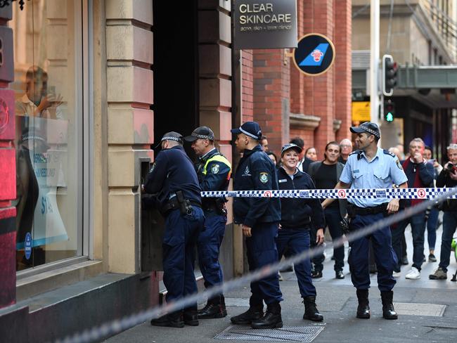 Police investigate the area around a crime scene after a man stabbed a woman and attempted to stab others in central Sydney. Picture: AAP