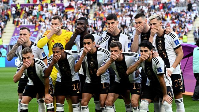 Players of Germany gesture as they pose for the group picture ahead of their match against Japan.