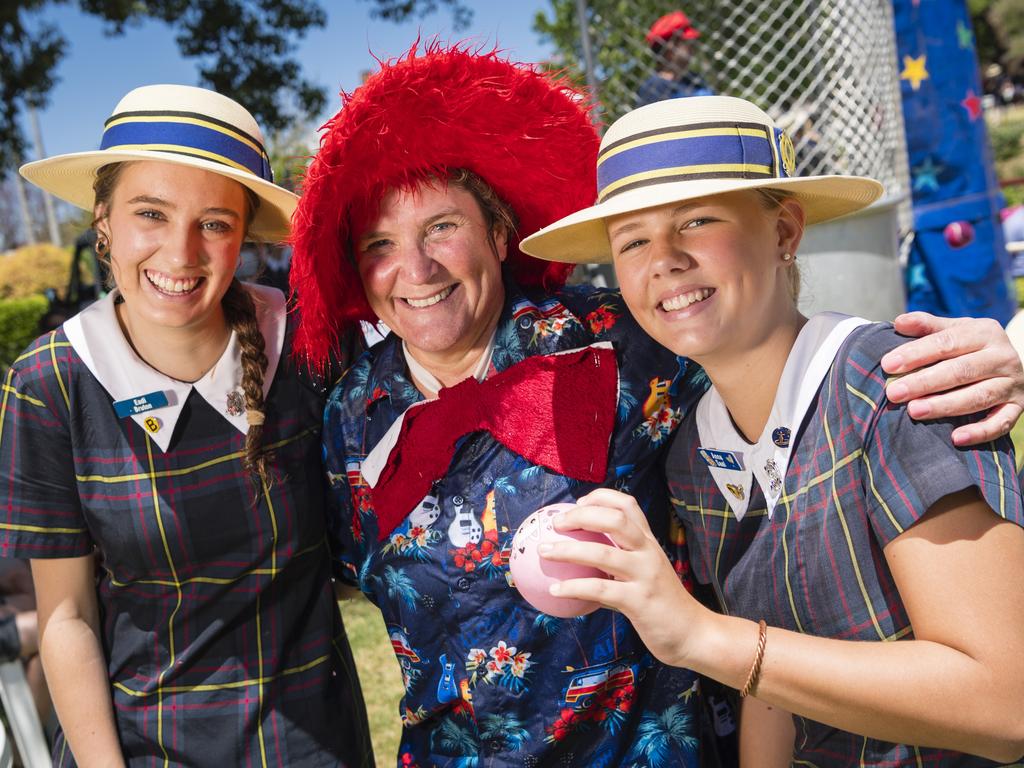 Students Eadi Burton (left) and Anna Saal were happy to see deputy head of boarding Lindy Masters get dunked on the dunking machine Fairholme College Spring Fair, Saturday, October 21, 2023. Picture: Kevin Farmer