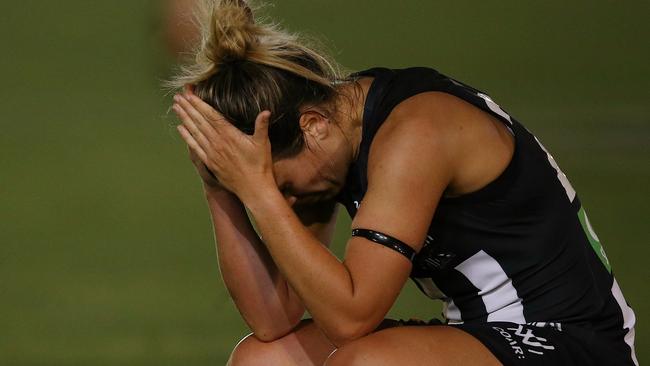 Sophie Casey holds her head in her hands after laying the brutal bump. Picture: Wayne Ludbey