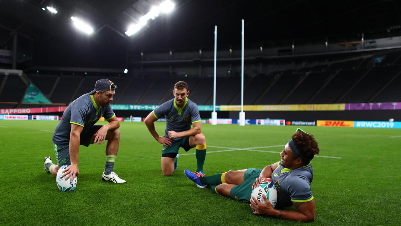 Wallaies (l-r) Adam Ashley-Cooper, Nic White and Will Genia have a chat at the Sapporo Dome on Friday ahead of their Rugby World Cup opener against Fiji.