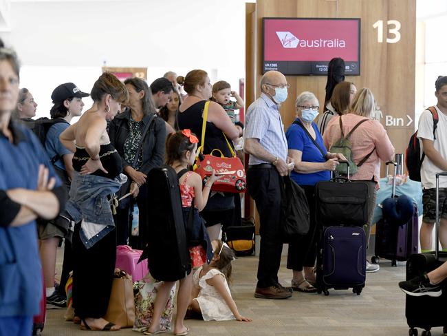 8/1/21 - Passengers wait to board a plane to Brisbane at Adelaide Airport after the announcement that the city is going into a 3 day lockdown. Picture: Naomi Jellicoe