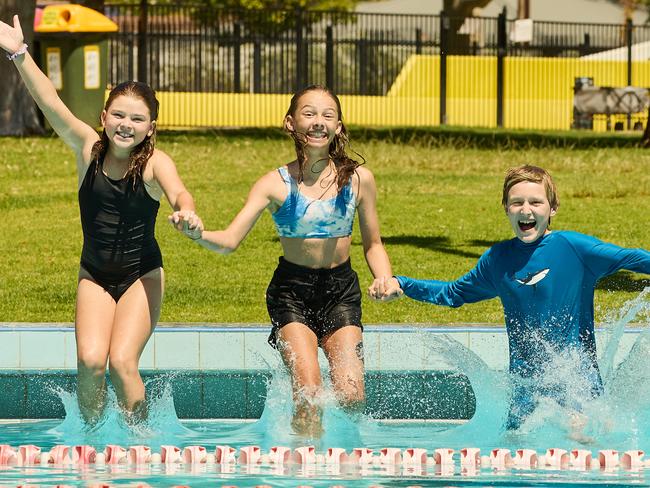 Brooklyn Hassan, 10, Ruby Carter, 13, and Alfie McLachlan, 12 at the Marion Outdoor Pool in Park Holme, Wednesday, Feb. 22, 2023. Picture: Matt Loxton [BrooklynÃs mum, Kate 0414470529, RubyÃs mum, Kate 0414410850]