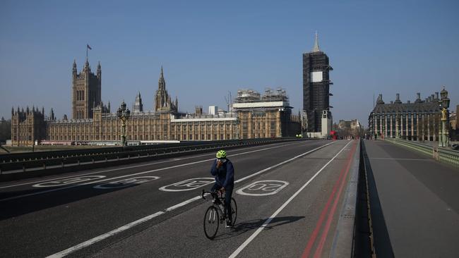 A cyclist crosses a near empty Westminster Bridge Picture: AFP