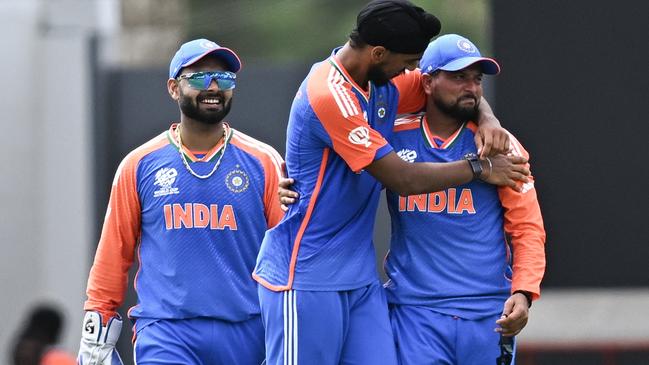 India's Arshdeep Singh celebrates with teammate Kuldeep Yadav. Picture: Chandan Khanna / AFP