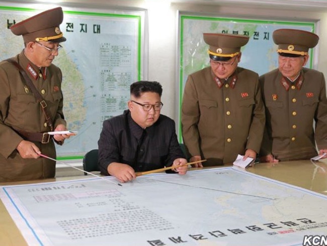 This North Korean supplied image purports to show Kim Jong-un being briefed at the KPA Strategic Force HQ on plans to launch ballistic missiles towards the US territory of Guam.
