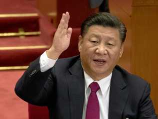 Chinese President Xi Jinping raises his hand to show approval of a work report during the closing ceremony for the 19th Party Congress at the Great Hall of the People in Beijing, China, Tuesday, Oct. 24, 2017. The ruling Communist Party on Tuesday formally lifted Xi Jinping's status to China's most powerful ruler in decades, setting the stage for the authoritarian leader to tighten his grip over the country while pursuing an increasingly muscular foreign policy and military expansion. (AP Photo/Ng Han Guan). Picture: Ng Han Guan