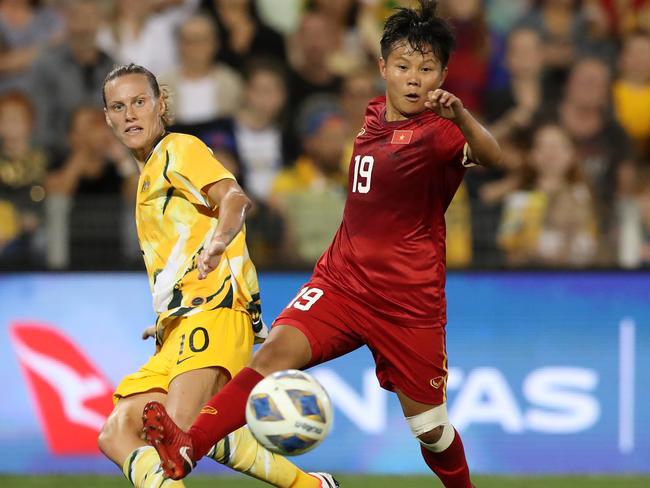 Nguyen This Bich Thuy of Vietnam contests the ball with Emily van Egmond of the Australian Matildas during the Women's Olympic Football Tournament Play-Off match. Picture: Tony Feder/Getty