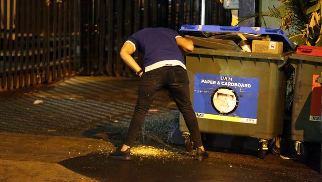 Out of order... Bulldogs player vomits in the street. Picture: Christian Gilles