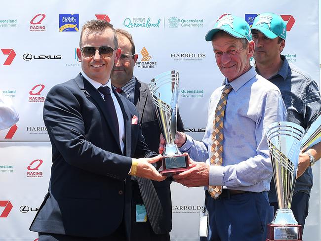 Trainer Gerald Ryan (right) poses for a photo after Problem Solver won race 1, the Magic Millions Maiden Plate, during the Gold Coast Magic Millions at Aquis Park, Gold Coast Turf Club, Queensland, Saturday, January 13, 2018. (AAP Image/Albert Perez) NO ARCHIVING, EDITORIAL USE ONLY