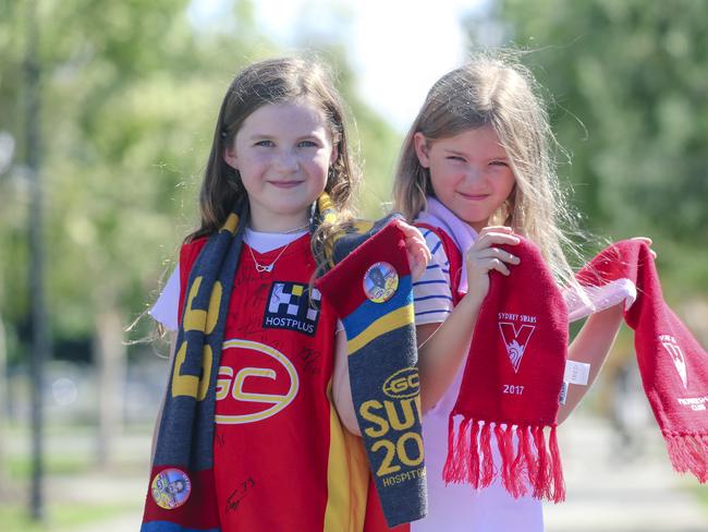 Mia Hawkins (9) and Charlotte Cziesche (8) before the Gold Coast Swans take on the Sydney Swans at People First Stadium, Carrara. Picture: Glen Campbell