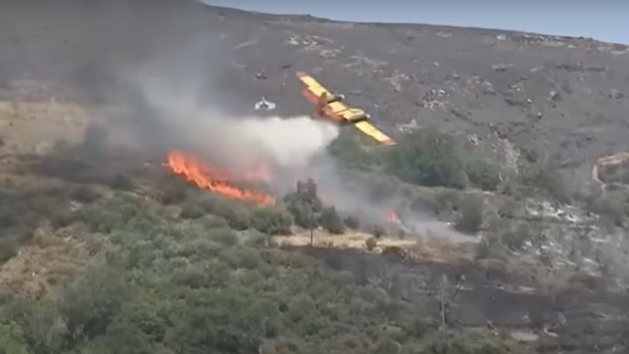 A Canadair plane douse flames on the island of Evia. Picture: Supplied