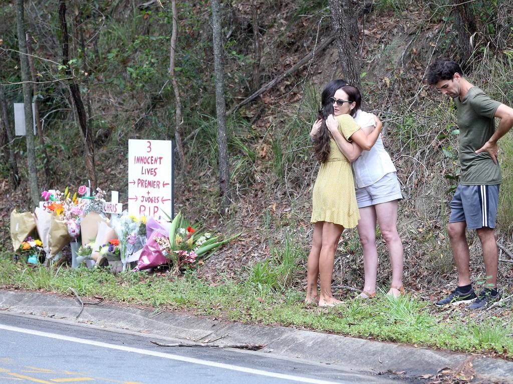 Claudine Snow is given a hug at the scene of the crash. Picture: Richard Gosling