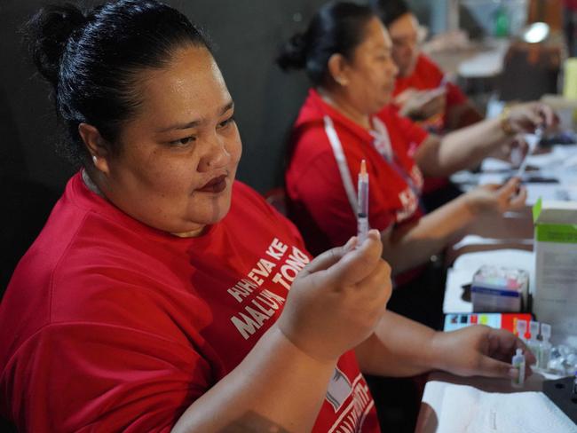 A Tongan nurse preparing a shot of Pfizer vaccine to vaccinate people against Covid-19 inside Queen Salote Memorial Hall in Nuku'alofa. Picture: AFP Photo