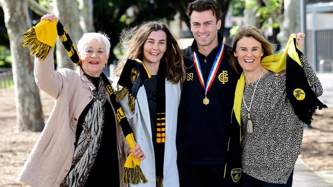 Magarey Medallist Luke Partington with his Nanna Beverley Ollivier, sister Shae Partington and mum Amanda Partington at Magarey Grove Adelaide Oval. Picture: AAP Image/Mark Brake