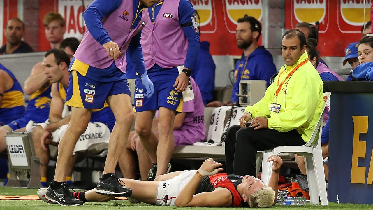 Matt Guelfi lies on the deck at Optus Stadium.