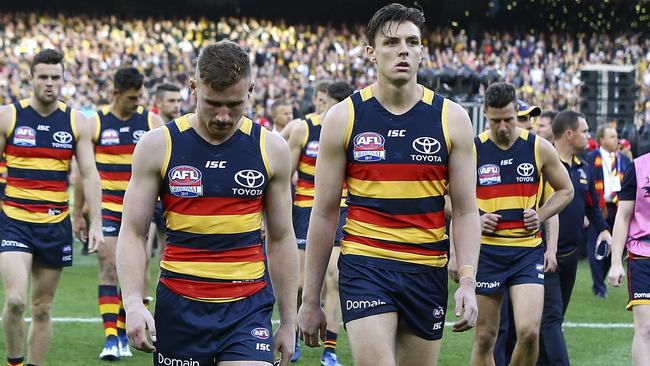 Rory Laird and Jake Lever walk off the MCG. Picture: Sarah Reed