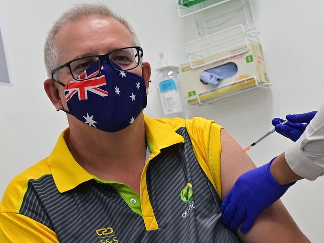 Australia's Prime Minister Scott Morrison receives a dose of the Pfizer/BioNTech Covid-19 vaccine at the Castle Hill Medical Centre in Sydney on February 21, 2021. (Photo by Steven SAPHORE / AFP)