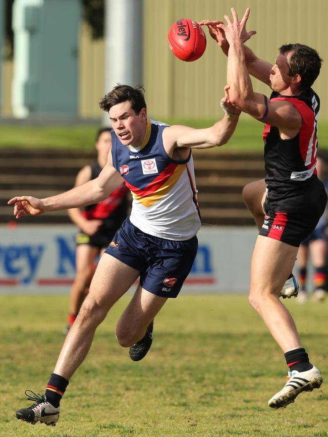 Crow Mitchell McGovern and West Jason Porplyzia go for the ball during a previous match at Richmond Oval. Picture: Tait Schmaal