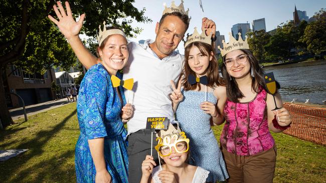 Angeles Landaida, Fernando Pavez, Matilde, 14, Gracia, 9, and Saba Marjani celebrate on the Yarra. Picture: Mark Stewart