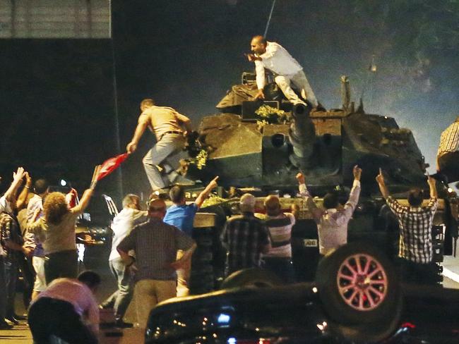 A tank moves into position as Turkish people attempt to stop them in the Turkish capital of Ankara. Picture: AP