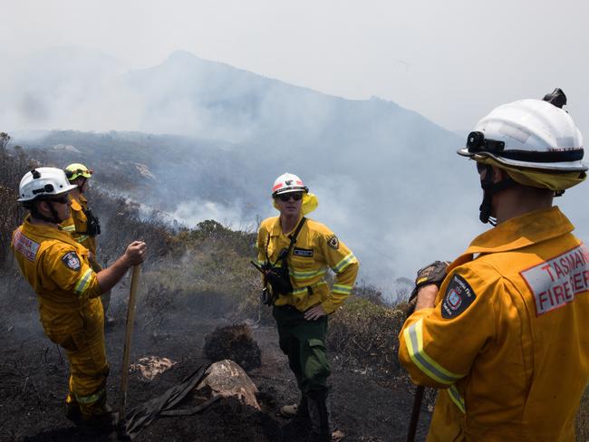 Gell River firefighters work on a ridge. Picture: TFS/WARREN FREY