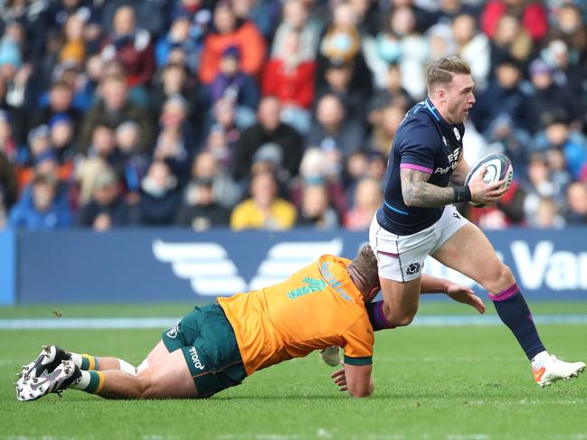 Wallabies prop James Slipper tackles Scotland ’s Stuart Hogg at Murrayfield. Picture: Ian MacNicol/Getty Images