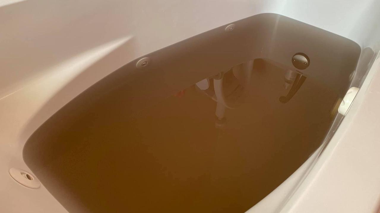 A man’s photo of a tub filled with dirty brown water has gone viral. Picture: Facebook/JaredGuynes