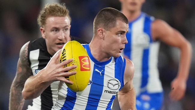 MELBOURNE, AUSTRALIA - JUNE 16: Bailey Scott of the Kangaroos runs with the ball during the round 14 AFL match between North Melbourne Kangaroos and Collingwood Magpies at Marvel Stadium, on June 16, 2024, in Melbourne, Australia. (Photo by Daniel Pockett/Getty Images)