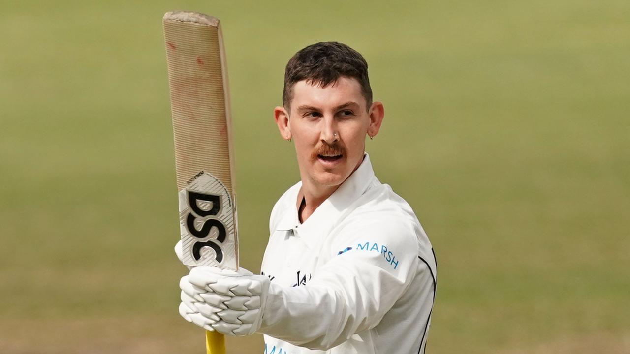 Nic Maddinson celebrates after reaching his double century against South Australia.
