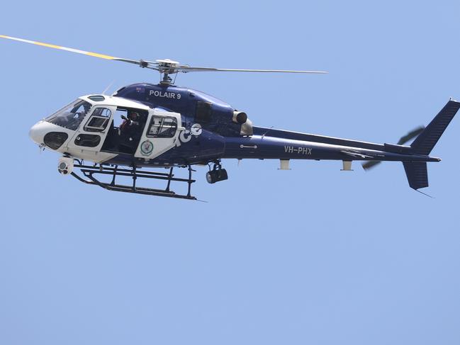 SYDNEY, AUSTRALIA - NewsWire Photos. December 1, 2020. NSW Police helicopter POLAIR 9 flies over the CBD.  Sydney, NSW. Picture: NCA NewsWire / Dylan Coker