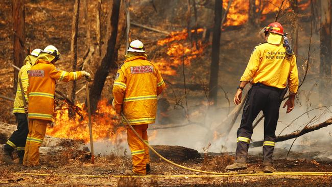 Fire crews fight to contain a blaze burning through Ben Bullen, northwest of Sydney, on Friday. Picture: Sam Ruttyn