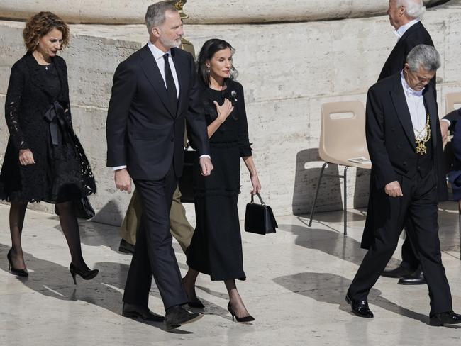 Spain's Queen Letizia, with King Felipe VI, also donned a veil. Picture: AP