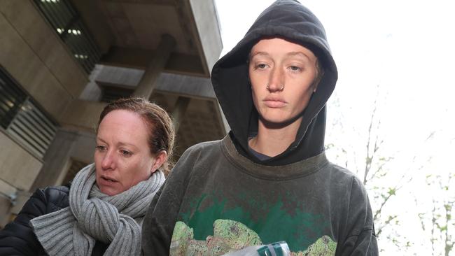 Blockade Australia protesters Mali Cooper, right, released from Surry Hills police station after she blocked the Harbour Tunnel and used a bike lock around her neck and steering wheel to lock herself in the car. Picture: NCA NewsWire / David Swift