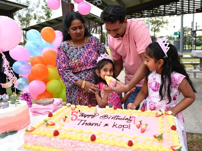 Tharnicaa Nadesalingam enjoys her birthday cake with her family. Picture: Dan Peled/Getty Images