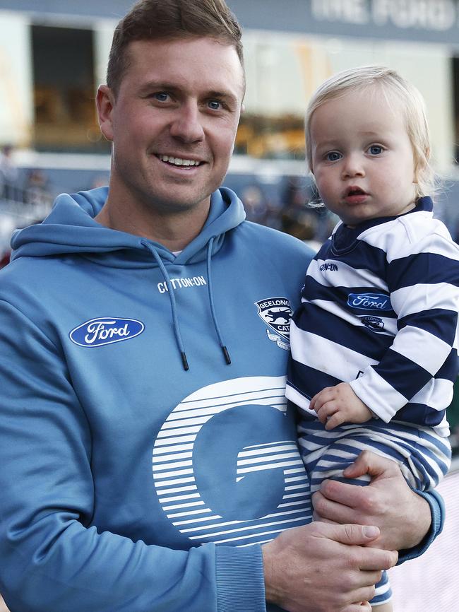 Mitch Duncan and son Oliver after the match.