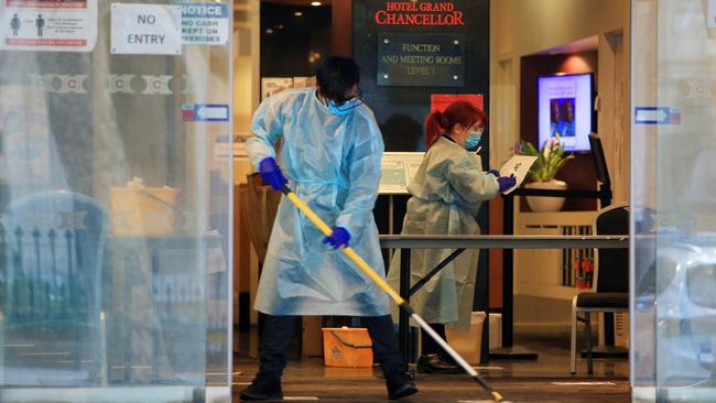 Staff at the Grand Chancellor on Lonsdale Street, Melbourne, on Sunday, where safety concerns have been raised about quarantine protocols. Picture: Aaron Francis