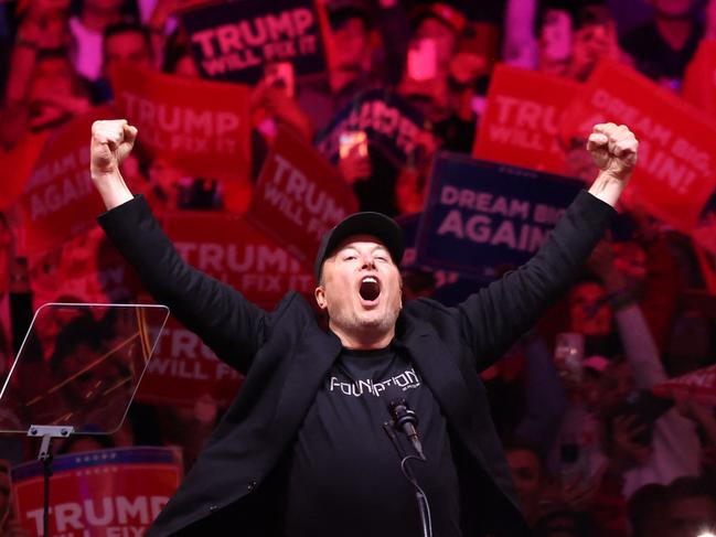 Tesla and X CEO Elon Musk raises his hands as he takes the stage. Picture Getty