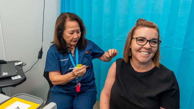 Registered nurse Jane Hunter prepares to vaccinate Moranbah resident Lisa Thies at the vaccination hub BHP is supporting in Moranbah, Queensland. 27 Aug 2021, Covid-19 Vaccination Hub. Photo: Daryl Wright