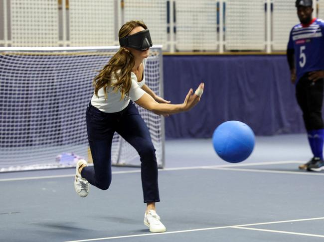 Kate took part in goalball, donning the special goggles. Picture: Suzanne Plunkett/Pool/AFP